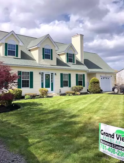 Grand View Landscaping Model Home with Freshly Mowed Grass - Larger